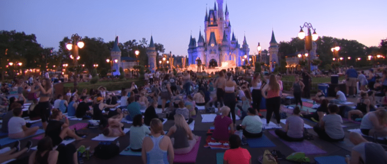 Disney Cast Members participate in Sunrise Yoga once again in the Magic Kingdom | Chip and Company