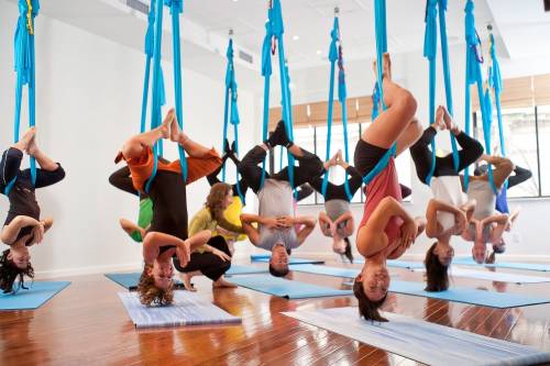 Aerial Yoga Benefits: Back Pain Relief, Weight Loss + More Science-Backed Reasons to Try Antigravity Yoga - The Yoga Nomads