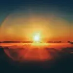 calm body of water during sunset