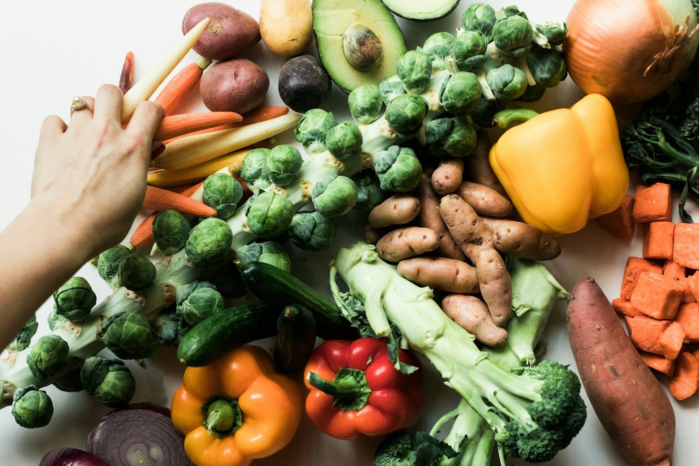 Assorted fresh vegetables arranged on a white plate