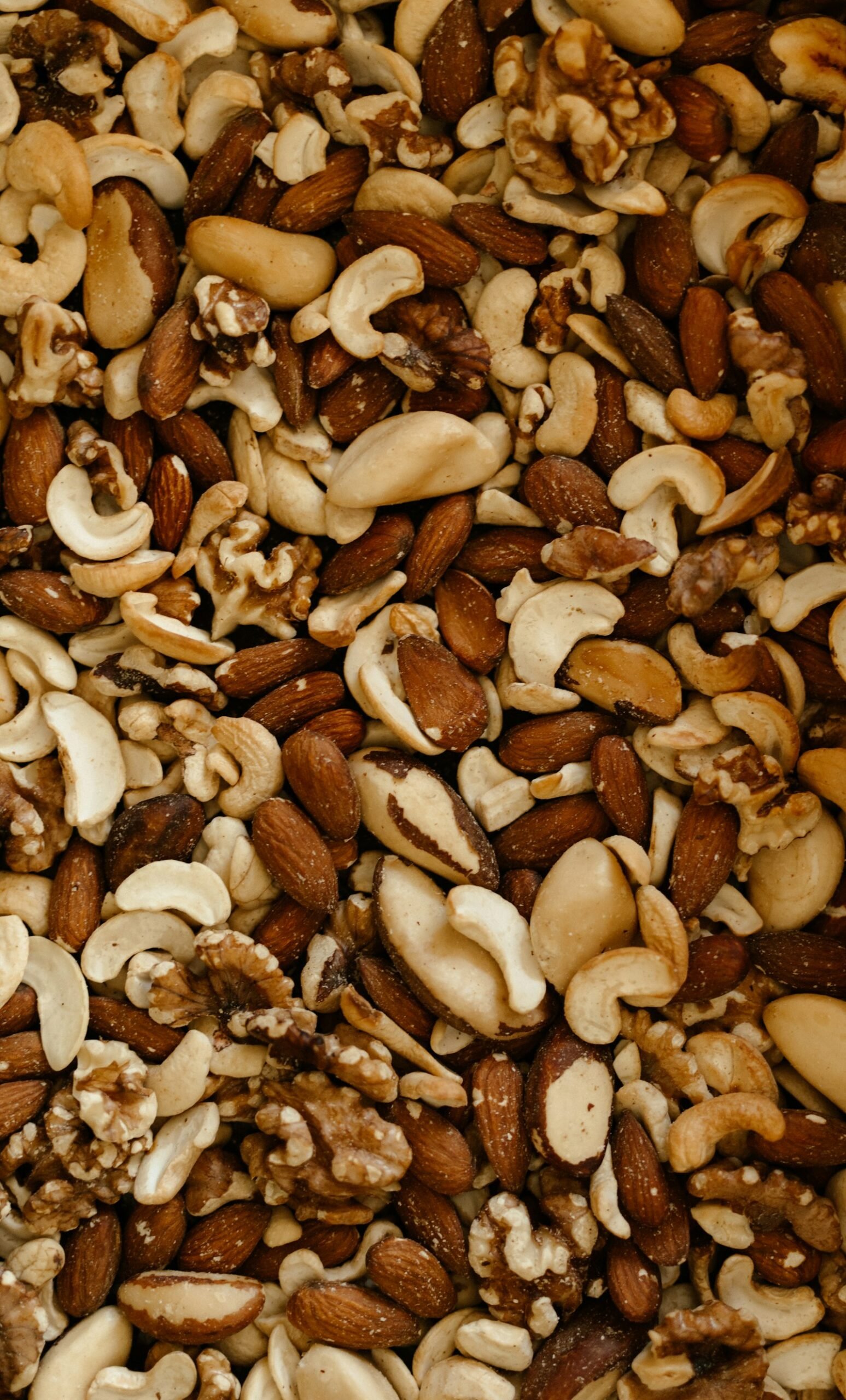 A mixture of nuts and nutshells in a bowl