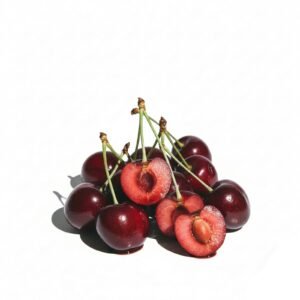 Pile of fresh, ripe cherries, some cut in half