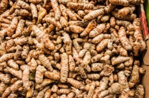 Pile of fresh turmeric roots