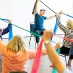 A group of older adults exercising together in a class