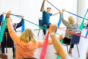 A group of older adults exercising together in a class