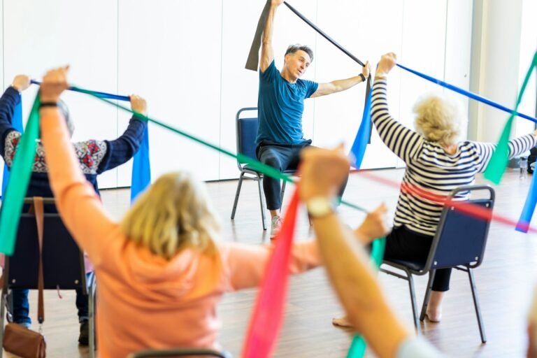 A group of older adults exercising together in a class
