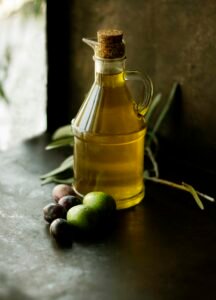Glass cruet of golden olive oil