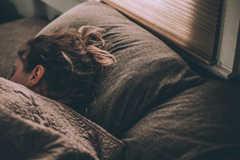 Woman sleeping peacefully under blankets