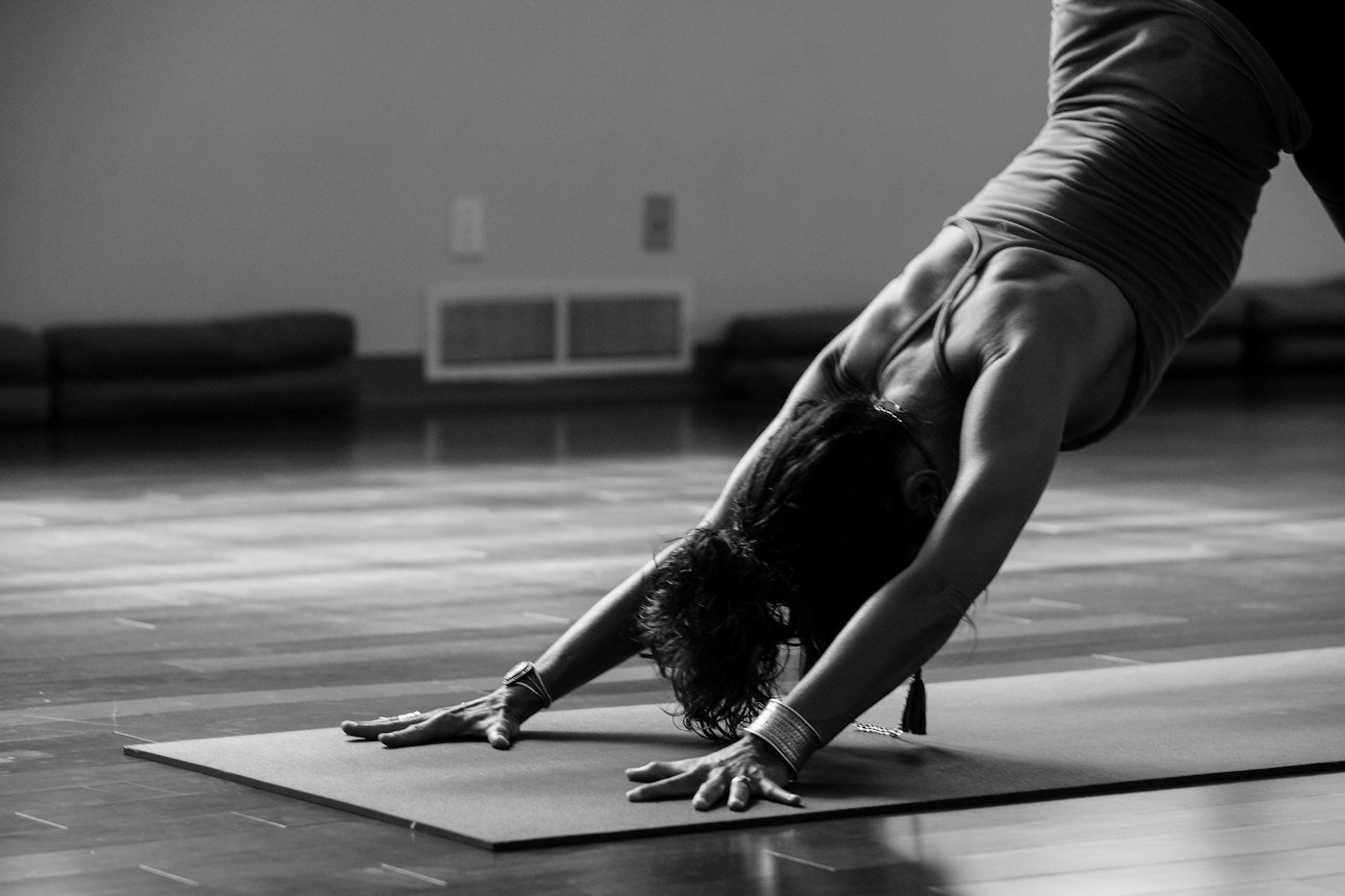 Woman doing a gentle yoga stretch on the floor